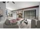 Stylishly furnished living room featuring a cozy fireplace, ample seating, and an adjacent dining area at 12 Robyn Ln, Haines City, FL 33844