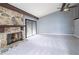 Spacious living room with a stone fireplace, vaulted ceilings, and ample natural light at 12 Robyn Ln, Haines City, FL 33844