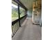 Cozy screened in patio featuring a stone pillar and wooded views at 12 Robyn Ln, Haines City, FL 33844