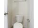 Cozy, simple bathroom featuring a toilet and chrome fixtures at 12035 Holystone St, Winter Garden, FL 34787