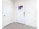Bright foyer with a glass-paned front door and neutral ceramic tile flooring at 12035 Holystone St, Winter Garden, FL 34787