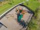 Aerial view of a playground with slides, swings, and a wood chip ground covering at 12035 Holystone St, Winter Garden, FL 34787