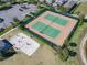 Aerial view of community tennis courts and a sand volleyball court at 12035 Holystone St, Winter Garden, FL 34787