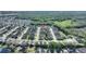 Beautiful aerial view of the neighborhood with lush green landscaping and well-maintained homes at 121 Fitzgerald Ln, Davenport, FL 33837