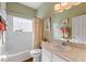 Cozy bathroom with vanity, toilet, and shower and tub combo at 121 Fitzgerald Ln, Davenport, FL 33837