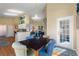 Cozy dining area adjacent to kitchen and living room featuring hard wood floors and lots of natural light at 121 Fitzgerald Ln, Davenport, FL 33837