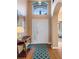 Inviting entryway with high ceilings, beautiful flooring, and stylish decor at 121 Fitzgerald Ln, Davenport, FL 33837