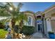 Inviting home featuring lush landscaping, a stone garden, and a welcoming entryway at 121 Fitzgerald Ln, Davenport, FL 33837