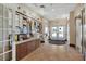 A clubhouse hallway with a message board, exit, and tile flooring at 121 Fitzgerald Ln, Davenport, FL 33837