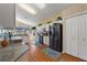 Bright kitchen features white cabinets, modern appliances, wood floors, and recessed lighting at 121 Fitzgerald Ln, Davenport, FL 33837
