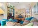 Spacious living room with hardwood floors, comfortable seating, and an open layout to the dining room at 121 Fitzgerald Ln, Davenport, FL 33837