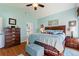 Spacious main bedroom with a ceiling fan and ensuite bathroom at 121 Fitzgerald Ln, Davenport, FL 33837