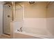 Bathroom with a bathtub and glass door shower plus tile surround at 1230 Wright Cir # 5309, Celebration, FL 34747