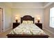 Bright bedroom with a ceiling fan, windows, and bed with two dressers on either side at 1230 Wright Cir # 5309, Celebration, FL 34747