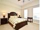 Bright bedroom featuring a decorative bedspread, side tables and lots of natural light at 1230 Wright Cir # 5309, Celebration, FL 34747