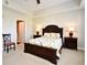 Bedroom with a ceiling fan, a door to the bathroom, and two dressers on either side at 1230 Wright Cir # 5309, Celebration, FL 34747