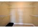 Walk-in closet features multiple shelves and hanging rods for optimal storage and organization at 1230 Wright Cir # 5309, Celebration, FL 34747