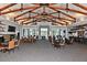 Spacious clubhouse interior with beamed ceilings, fireplace, tv, and comfortable seating for gatherings at 1230 Wright Cir # 5309, Celebration, FL 34747