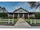 Inviting clubhouse exterior featuring stone pathway, manicured landscaping, and charming architectural details at 1230 Wright Cir # 5309, Celebration, FL 34747