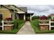 Charming community building entrance framed by lush landscaping and decorative planters at 1230 Wright Cir # 5309, Celebration, FL 34747