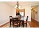 Dining area with hardwood floors, light fixture, and passthrough to the kitchen at 1230 Wright Cir # 5309, Celebration, FL 34747