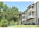 Exterior view of a condominium building featuring balconies and landscaping at 1230 Wright Cir # 5309, Celebration, FL 34747