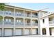 A well-maintained apartment building with multiple floors, balconies, and attached garages at 1230 Wright Cir # 5309, Celebration, FL 34747