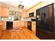 Beautiful kitchen with stainless steel appliances, granite countertops, and hardwood floors at 1230 Wright Cir # 5309, Celebration, FL 34747