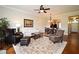 Comfortable living room with hardwood floors, ceiling fan, and view of the dining area at 1230 Wright Cir # 5309, Celebration, FL 34747