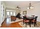 Open living area with hardwood floors, ceiling fan, French doors and a dining table at 1230 Wright Cir # 5309, Celebration, FL 34747