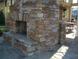 A close up view of the community's outdoor fireplace and stonework, designed for relaxation and conversation at 1230 Wright Cir # 5309, Celebration, FL 34747