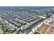 This aerial view shows a quiet residential neighborhood with lush greenery and community amenities nearby at 1454 Myrtlewood St, Davenport, FL 33896