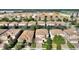 A captivating aerial view showcases a neighborhood with landscaped streets and well-maintained homes and yards at 1454 Myrtlewood St, Davenport, FL 33896