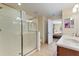 Well-maintained bathroom with a tiled shower, vanity, and access to the bedroom at 1454 Myrtlewood St, Davenport, FL 33896