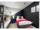 Themed bedroom featuring a bunk bed, a full bed with an orange blanket, and modern decor at 1454 Myrtlewood St, Davenport, FL 33896