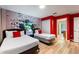 A themed bedroom with wood floors, a closet, and two beds, decorated with an image of the Hulk at 1454 Myrtlewood St, Davenport, FL 33896