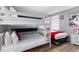 Cozy ' bedroom featuring bunk beds, a twin bed, and a playful Mickey Mouse theme at 1454 Myrtlewood St, Davenport, FL 33896