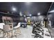 Spacious game room with a pool table, arcade games, basketball game, and comfortable gaming chairs for entertainment at 1454 Myrtlewood St, Davenport, FL 33896