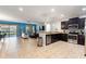 Open floor plan featuring a modern kitchen and adjoining living area at 1454 Myrtlewood St, Davenport, FL 33896