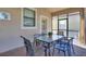 The outdoor patio offers a pleasant setting for dining and relaxation with an ornate table and chairs and a screened area at 1454 Myrtlewood St, Davenport, FL 33896