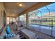Outdoor patio features a dining table, seating arrangements, and access to the pool area creating an outdoor gathering space at 1454 Myrtlewood St, Davenport, FL 33896