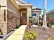 Inviting home exterior with brick accents, beautiful landscaping, and a welcoming front entrance with decorative wreath at 14945 Huntcliff Park Way, Orlando, FL 32824