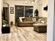 Inviting living room features stylish decor, comfortable seating and sliding glass doors to the patio at 14945 Huntcliff Park Way, Orlando, FL 32824