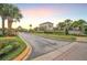 HUNTCLIFF PARK features lush landscaping and a secure gated entrance for resident safety and privacy at 14945 Huntcliff Park Way, Orlando, FL 32824
