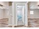 Bathroom with stylish blue shower curtain between two spacious bedrooms at 150 N Post Office Rd, Kenansville, FL 34739