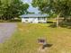 Quaint home on expansive lot with large trees and new landscaping at 150 N Post Office Rd, Kenansville, FL 34739
