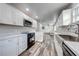 A bright and modern eat in kitchen with stainless steel appliances and eat in kitchen bar at 150 N Post Office Rd, Kenansville, FL 34739