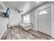 Cozy living room featuring comfortable seating and bright natural light at 150 N Post Office Rd, Kenansville, FL 34739