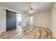 Main bedroom with sliding barn door to en suite bathroom and closet at 150 N Post Office Rd, Kenansville, FL 34739