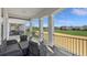 Wide balcony with golf course views provides outdoor seating space and natural light at 1506 Euston Dr, Reunion, FL 34747